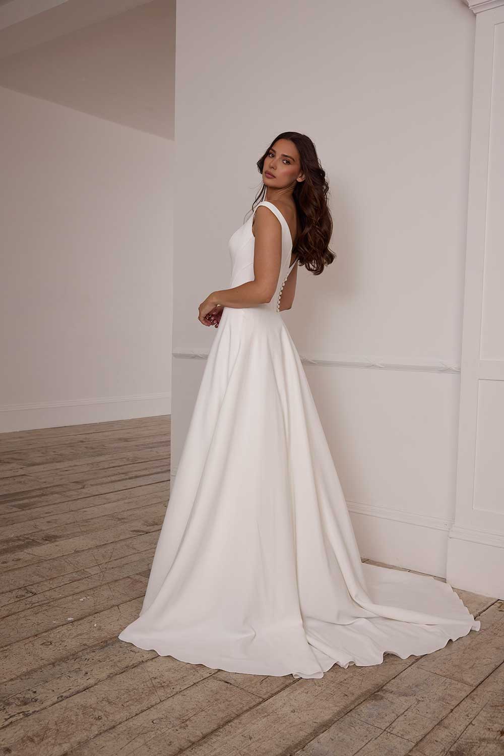 Suzanne Neville Fittonia bateau neck wedding dress with straps at Miss Bush bridal boutique in Surrey