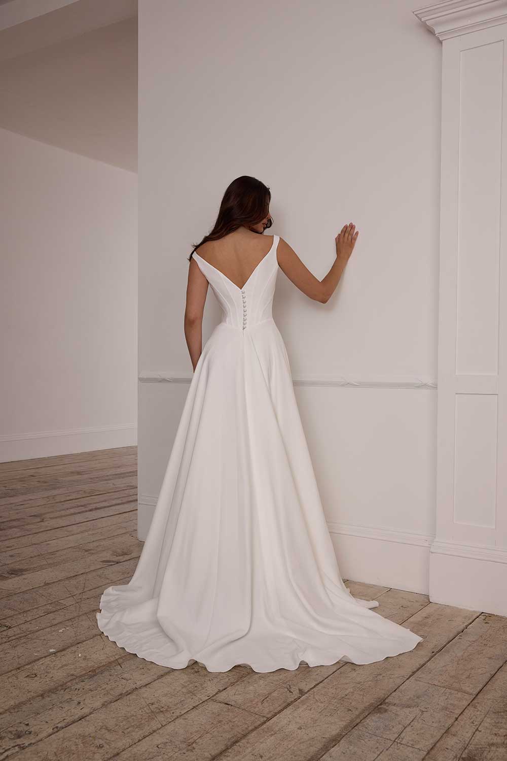 Suzanne Neville Fittonia bateau neck wedding dress with straps at Miss Bush bridal boutique in Surrey