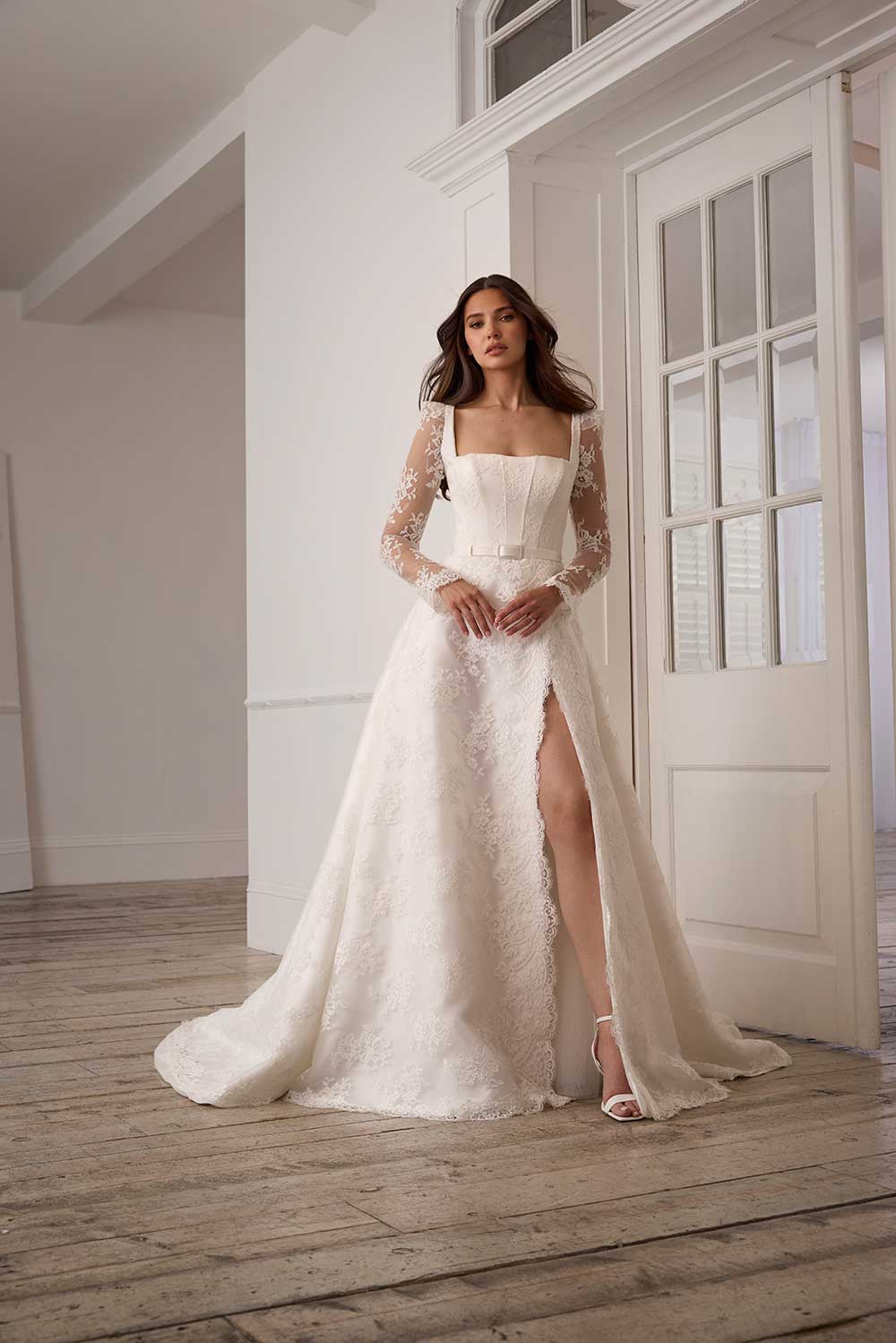 Suzanne Neville Florescence lace sleeve wedding dress with slit at Miss Bush bridal boutique in Surrey