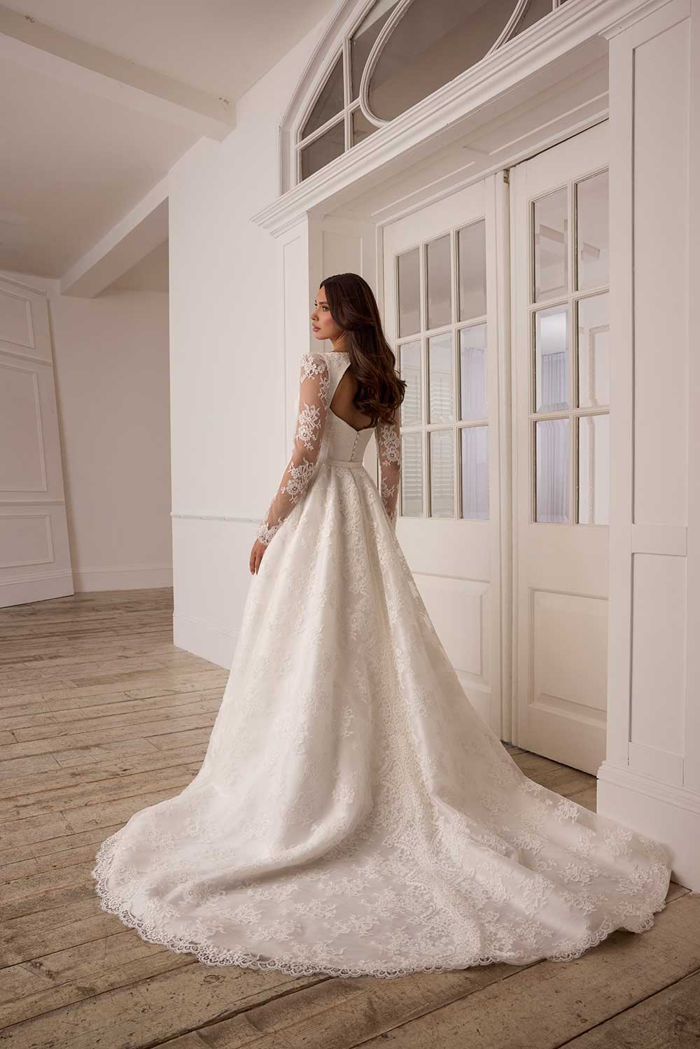 Suzanne Neville Florescence lace sleeve wedding dress with slit at Miss Bush bridal boutique in Surrey