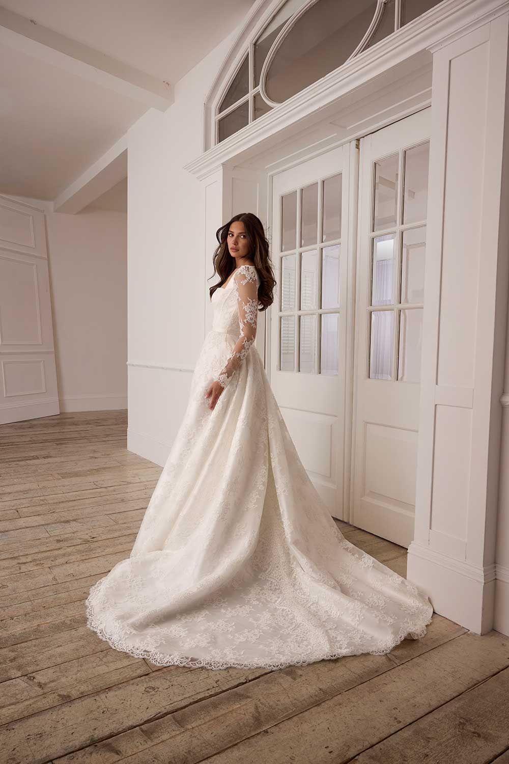 Suzanne Neville Florescence lace sleeve wedding dress with slit at Miss Bush bridal boutique in Surrey