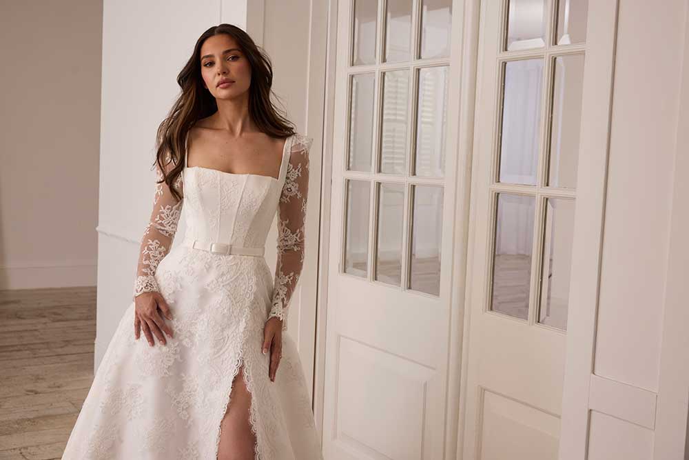 Suzanne Neville Florescence lace sleeve wedding dress with slit at Miss Bush bridal boutique in Surrey