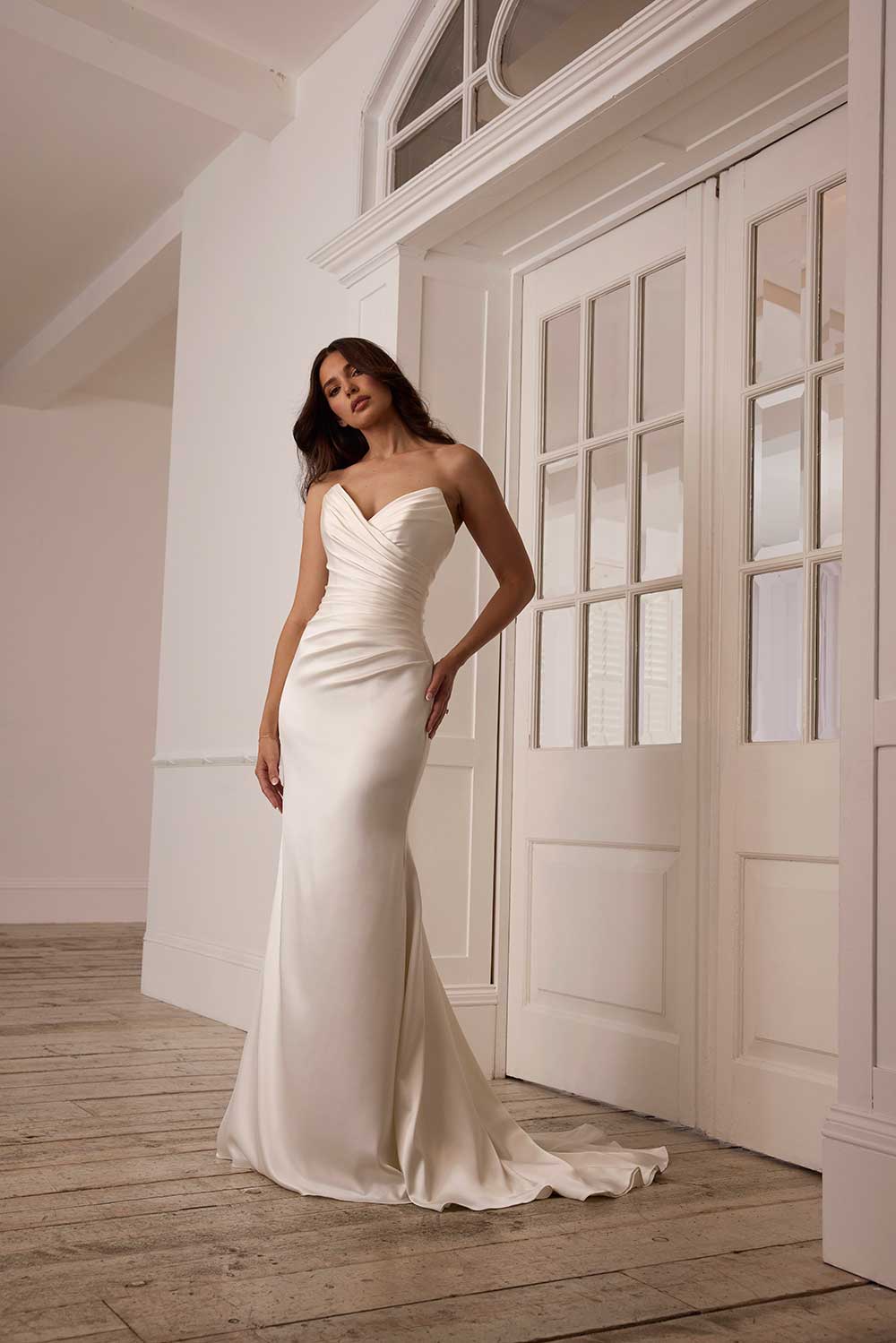 Suzanne Neville Saffron strapless ruched satin wedding dress at Miss Bush bridal boutique in Surrey